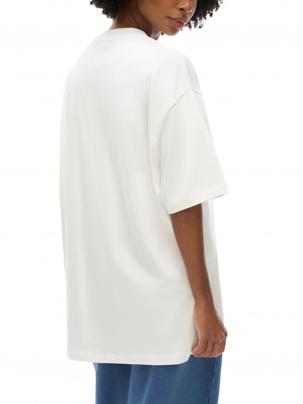 Unisex heavyweight Earth Tone T-shirt in White – rear three-quarter model view
