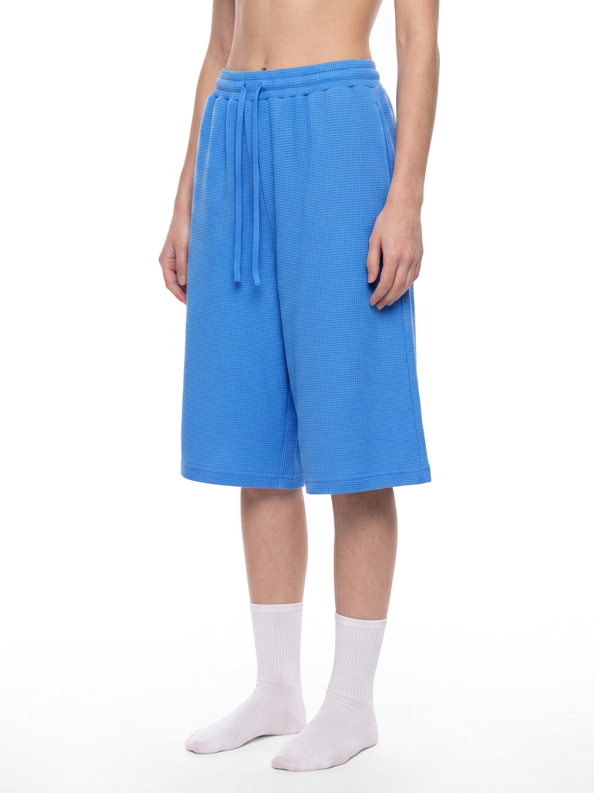 Off Script Unisex Waffle Shorts Colourful Blue model three-quarter view