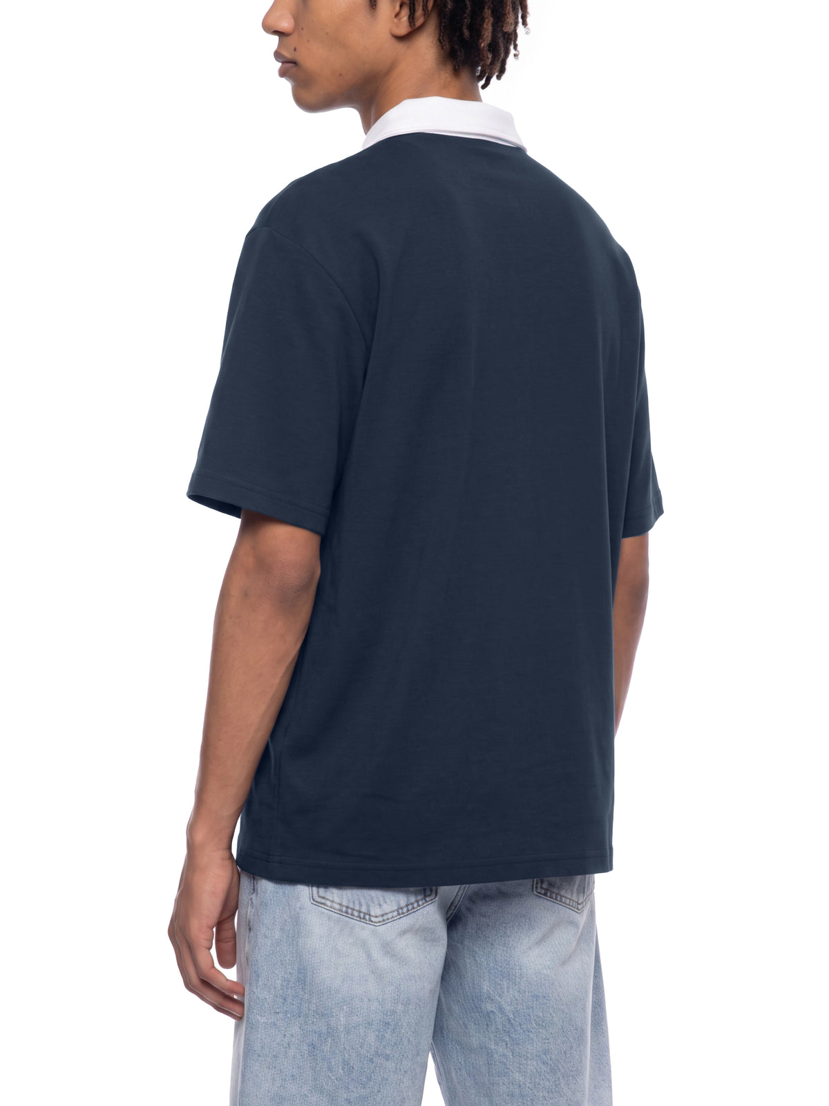 Off Script Unisex Color Block Quarter-Zip Polo Shirt on male model back three-quarter view