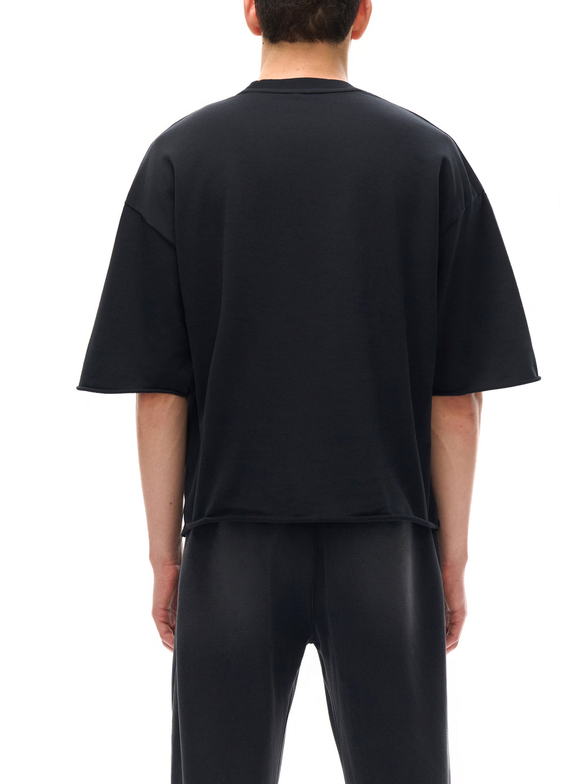 Unisex French Terry Raw-Edge T-Shirt in Black - model back view