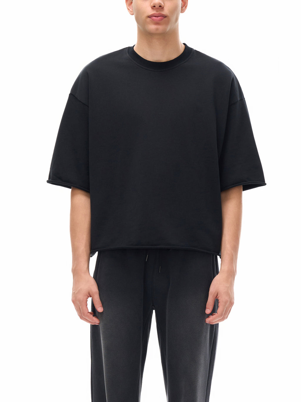 Unisex French Terry Raw-Edge T-Shirt in Black - model front view